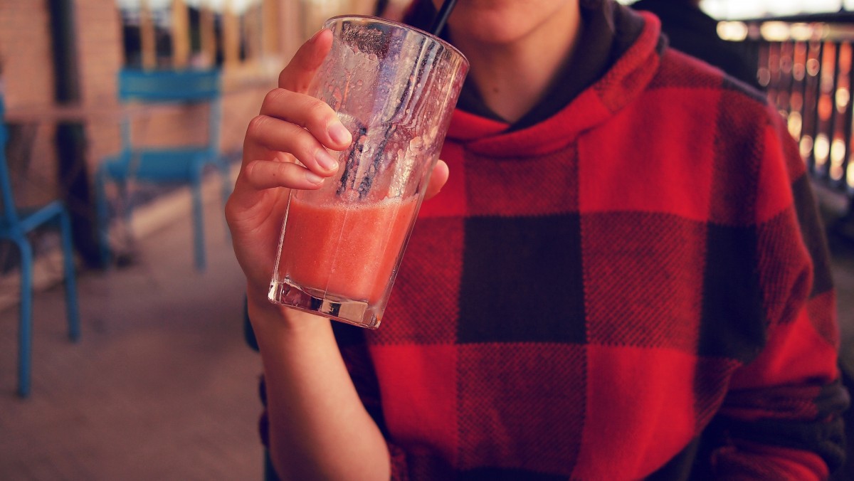 Girl drinking berry smoothie